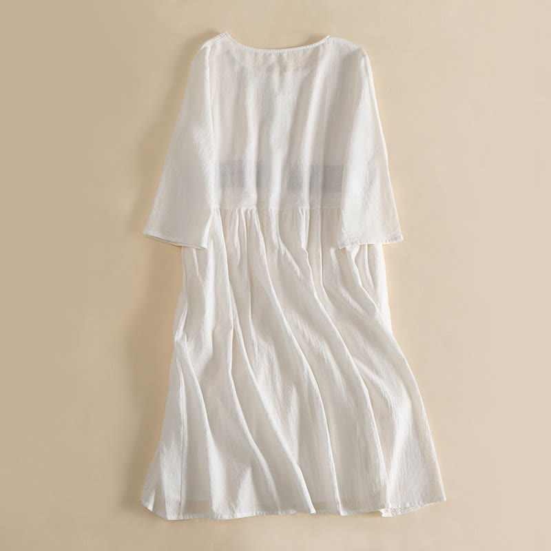 Relaxed Embroidered Midi Dress with Buttoned Neckline and Pockets