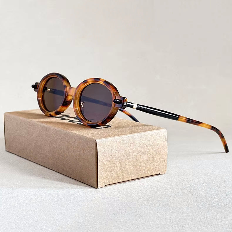 Vintage-Inspired Oval Sunglasses with Glossy Mottled Frames