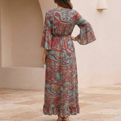 Flowing Bohemian Maxi Dress with Tiered Ruffles and Trumpet Sleeves