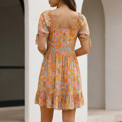 Flowing Bohemian Mini Dress with Ruffled Hem and Puff Sleeves