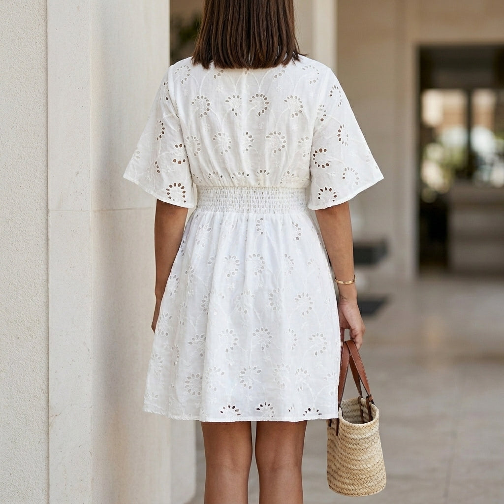 Elegant Eyelet Mini Dress with Smocked Waist and Feminine Silhouette