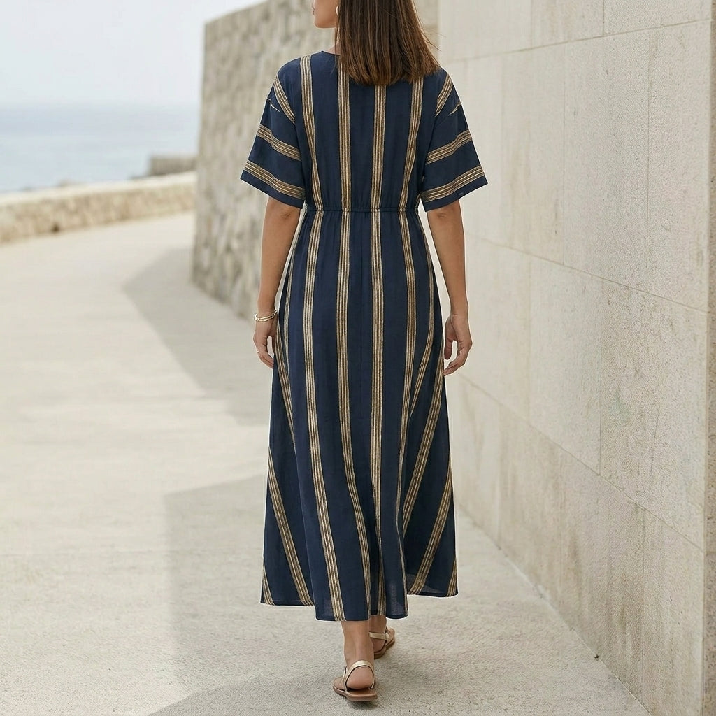 Elegant Pleated Flared Maxi Dress with Wrap-Style V-Neck and Textured Trim