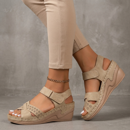 Textured Wedge Sandals with Laser-Cut Floral Accents and Adjustable Strap
