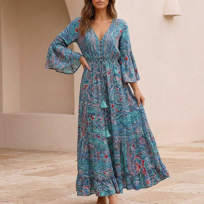 Flowing Bohemian Maxi Dress with Tiered Ruffles and Trumpet Sleeves