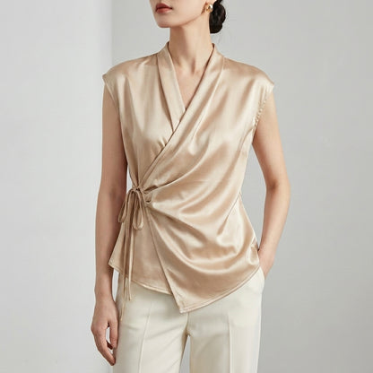 Tailored Sleeveless Wrap Blouse with Pleated Draping and Side Tie Closure
