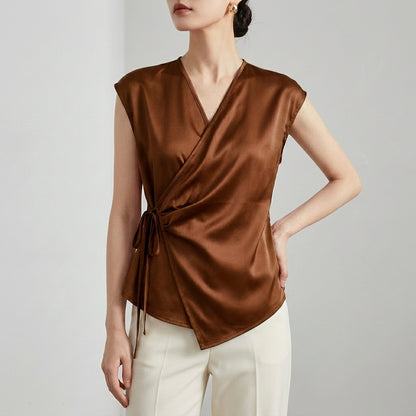 Tailored Sleeveless Wrap Blouse with Pleated Draping and Side Tie Closure