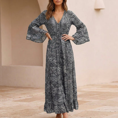 Flowing Bohemian Maxi Dress with Tiered Ruffles and Trumpet Sleeves