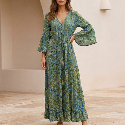 Flowing Bohemian Maxi Dress with Tiered Ruffles and Trumpet Sleeves