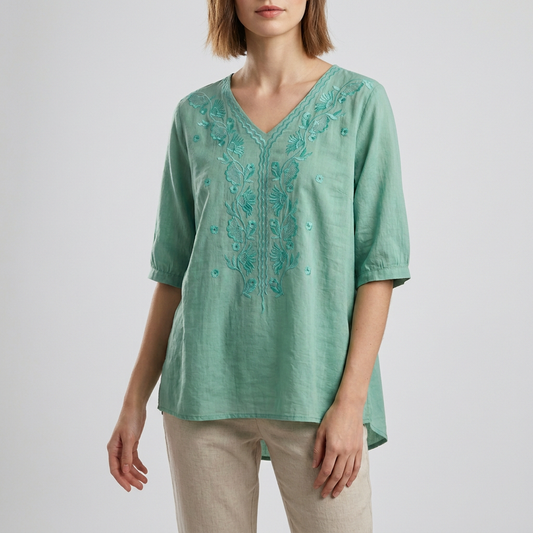 Relaxed V-Neck Blouse with Embroidered Floral Accents and High-Low Hem