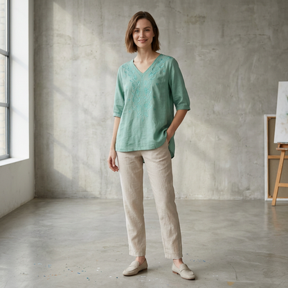 Relaxed V-Neck Blouse with Embroidered Floral Accents and High-Low Hem