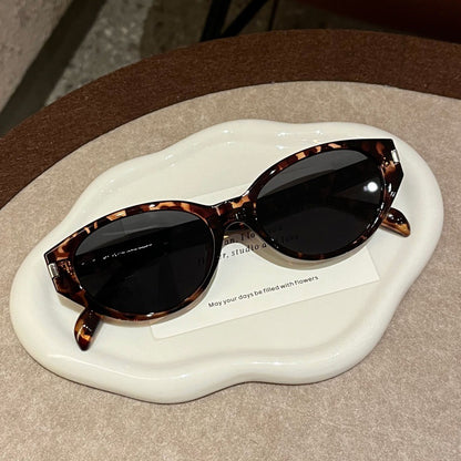 Retro-Inspired Narrow Cat-Eye Sunglasses with Glossy Structured Frame