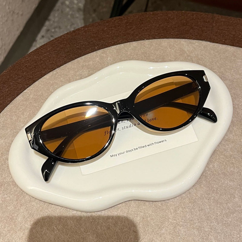 Retro-Inspired Narrow Cat-Eye Sunglasses with Glossy Structured Frame