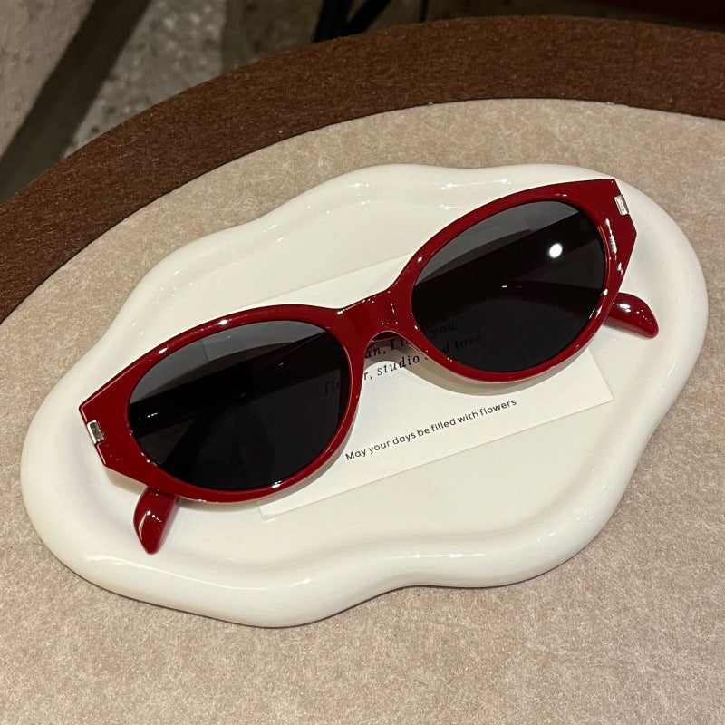 Retro-Inspired Narrow Cat-Eye Sunglasses with Glossy Structured Frame