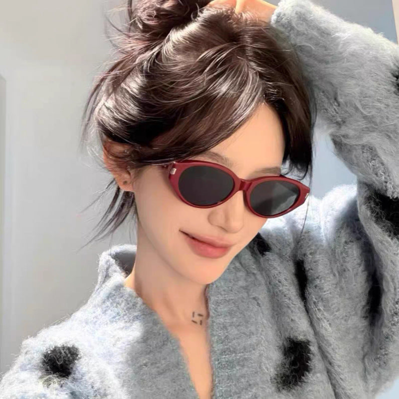 Retro-Inspired Narrow Cat-Eye Sunglasses with Glossy Structured Frame