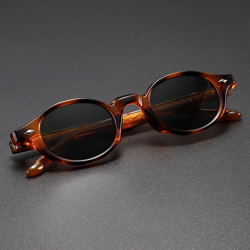 Vintage-Inspired Round Frame Sunglasses with Translucent Temples