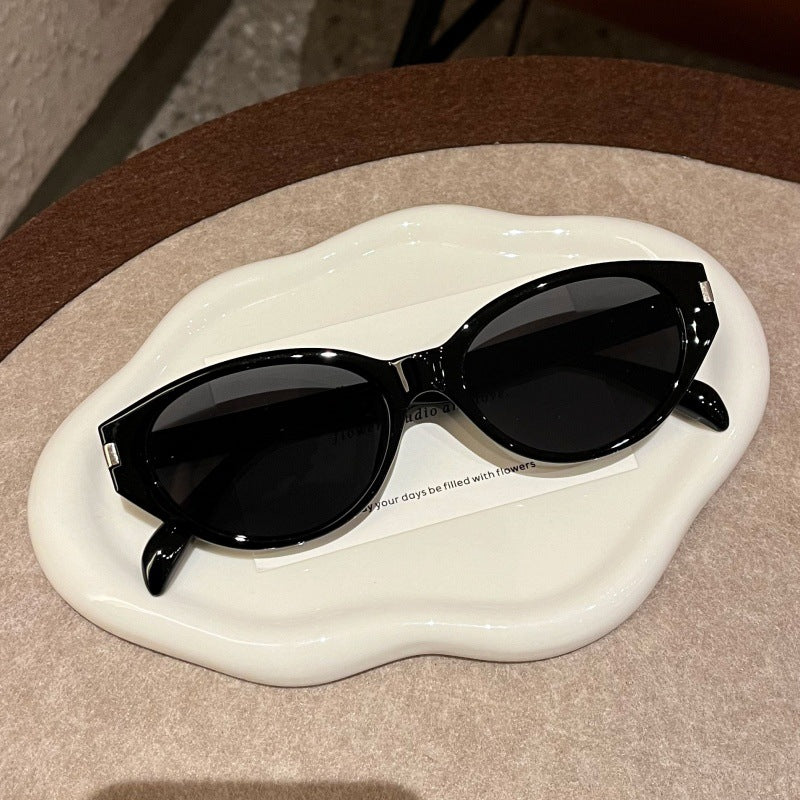 Retro-Inspired Narrow Cat-Eye Sunglasses with Glossy Structured Frame