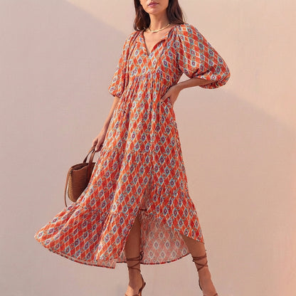 Elegant Flowing V-Neck Midi Dress with Puff Sleeves and Tiered Skirt