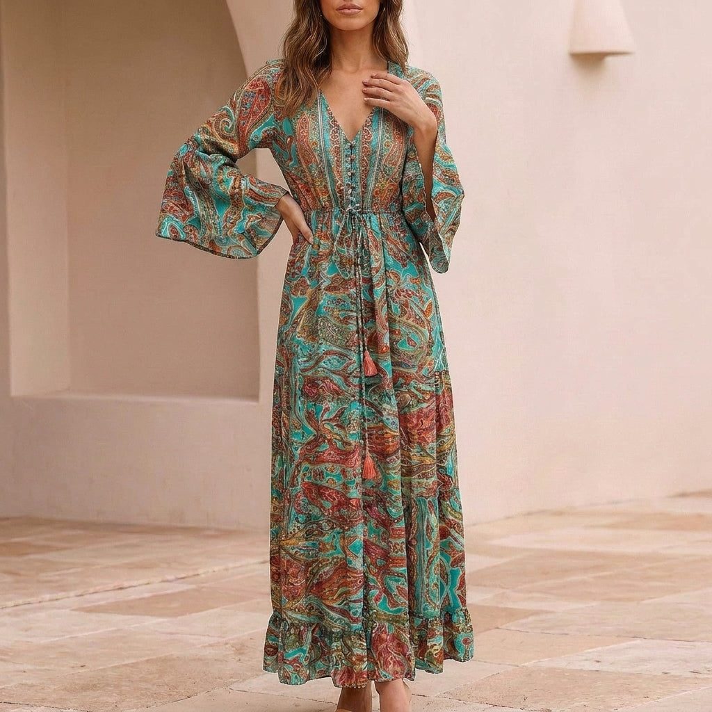Flowing Bohemian Maxi Dress with Tiered Ruffles and Trumpet Sleeves