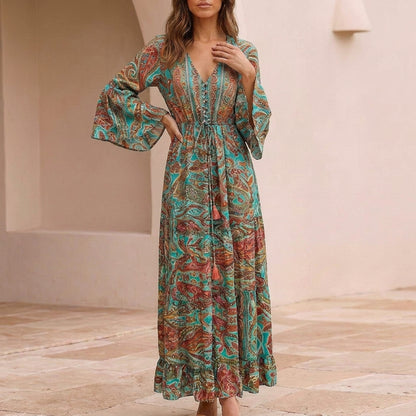Flowing Bohemian Maxi Dress with Tiered Ruffles and Trumpet Sleeves