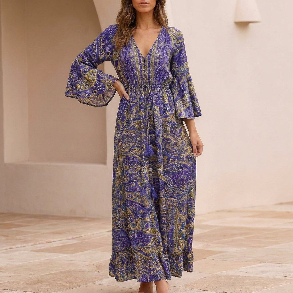 Flowing Bohemian Maxi Dress with Tiered Ruffles and Trumpet Sleeves