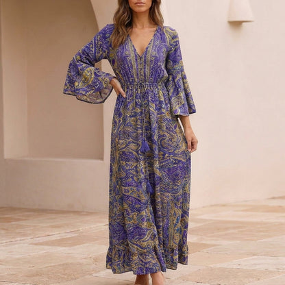 Flowing Bohemian Maxi Dress with Tiered Ruffles and Trumpet Sleeves