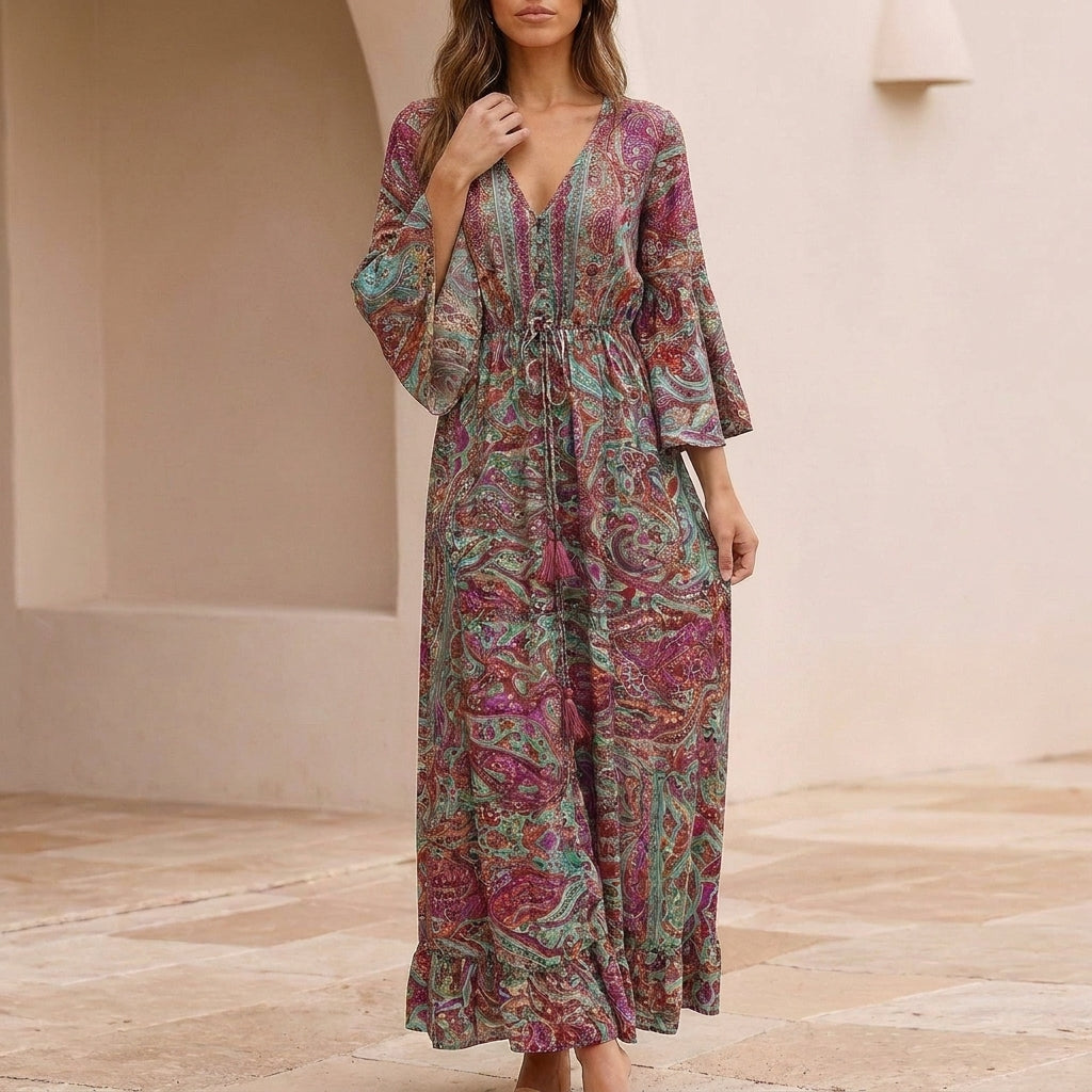 Flowing Bohemian Maxi Dress with Tiered Ruffles and Trumpet Sleeves