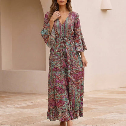 Flowing Bohemian Maxi Dress with Tiered Ruffles and Trumpet Sleeves
