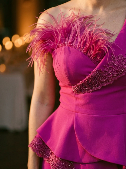 Elegantly Embellished Strapless Jumpsuit with Peplum Waist and Feather Detail