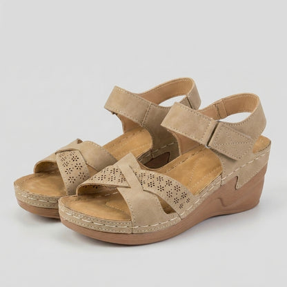 Textured Wedge Sandals with Laser-Cut Floral Accents and Adjustable Strap